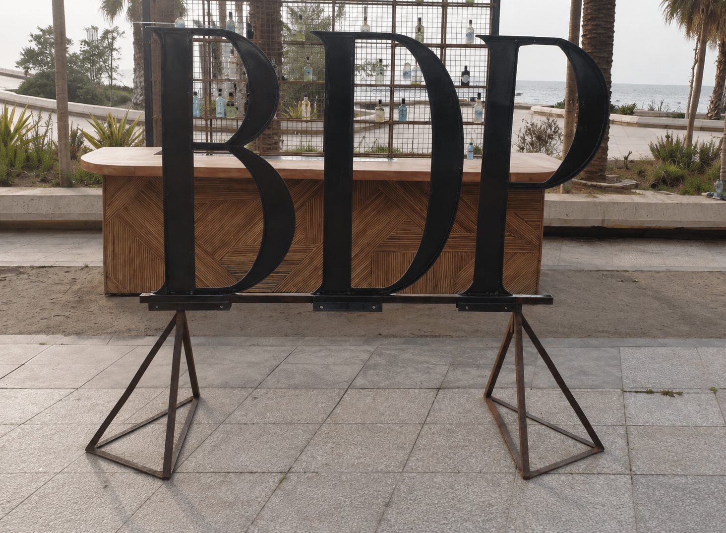 Large sculpted steel BDP lettering on steel stands