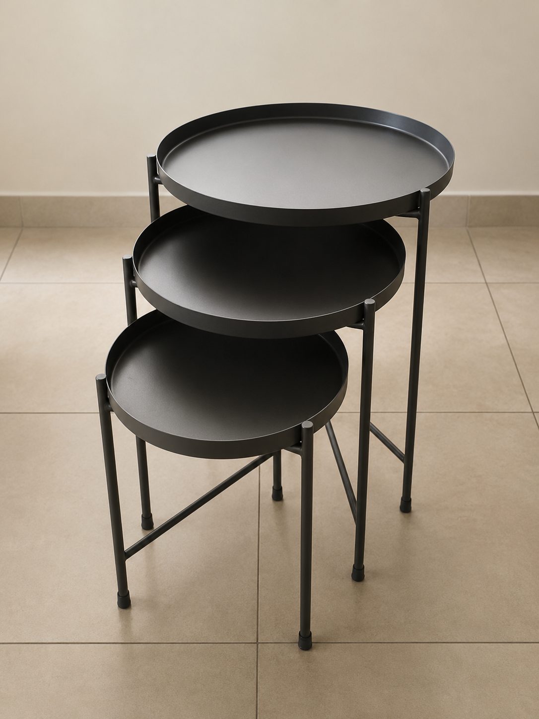 Set of three nesting round steel side tables